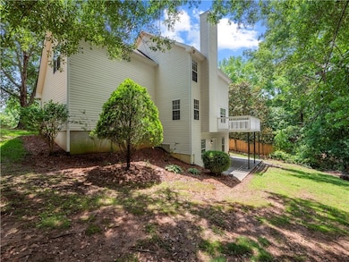View of property exterior with a chimney