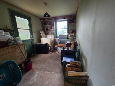 Misc room with washer / clothes dryer and concrete floors