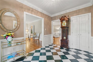 1st Flr- Entryway. Custom picture moldings w/ tile