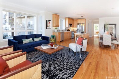 Living room opens to kitchen and dining; talk abou