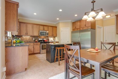 Large kitchen with granite and tile. Notice the HUGE refrigerator/freezer. Pantry is in the corner. What a set up!