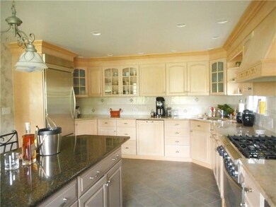 Beautiful cabinetry , kitchen isle and stainless s