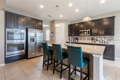 Gourmet kitchen showcasing **STAINLESS STEEL APPLI