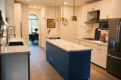 This bright kitchen has freshly painted cabinets w