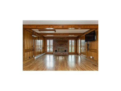 Spacious Family Room with Brick Fireplace and Plan