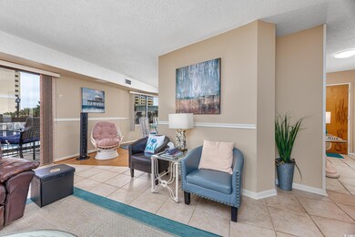 Tiled living room with a textured ceiling