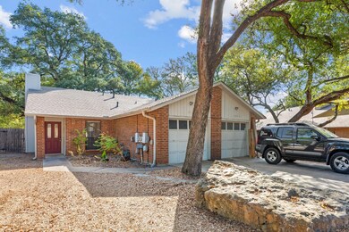 Single story home with brick siding, a chimney, an attached garage, concrete driveway, and roof with shingles