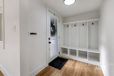 Mudroom with light wood-style flooring