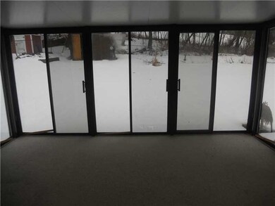 Sunroom. Glass enclosed room off of the kitchen ov