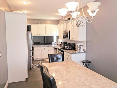 Kitchen featuring appliances with stainless steel 