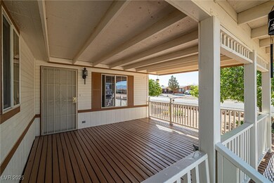 Wooden deck featuring a grill
