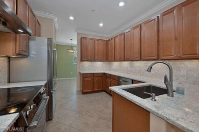 Kitchen featuring sink, ventilation hood, light st