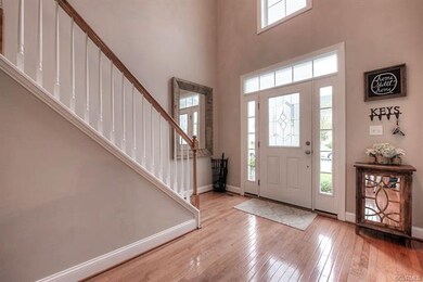 2 story foyer with oak hardwood floors.