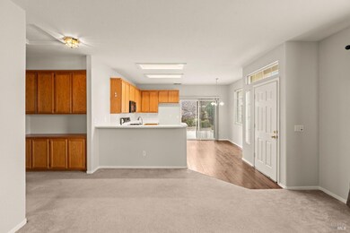 living room and kitchen; sliding glass door leads to backyard