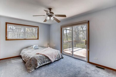 1st floor bedroom with deck and view of yard