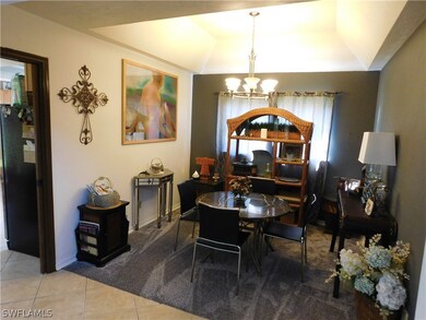 formal dining with tray ceilings and new carpet