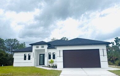 View of front of home featuring concrete driveway,