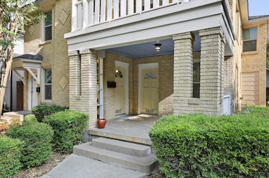 Entrance to property featuring brick siding