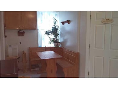 Kitchen. Custom made seating area and all applianc
