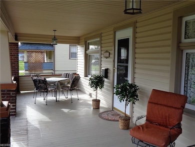 Huge front porch welcomes guest and provides a gre