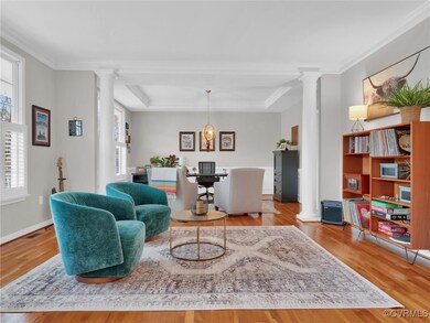 Living room featuring decorative columns, ornament