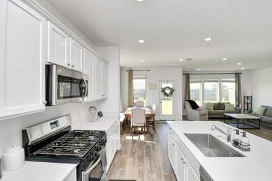 The kitchen overlooks the dining and living areas and is ready for its new owner.