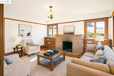 Living area featuring wood finished floors and a fireplace