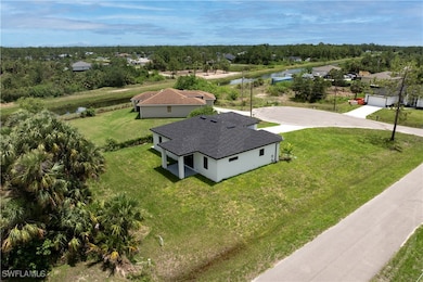 Aerial view of property and surrounding area with