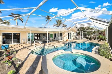 View of pool with an in ground hot tub, french doo