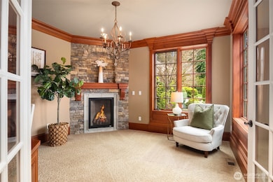 Handsome Office/Study with custom cabinetry, gas fireplace and stone surround