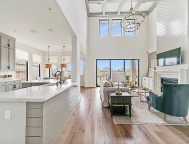 The open concept living room and kitchen makes for a great way to keep the party going and never miss a beat! (This is not the actual home but a completed model of this home, fixtures and colors may vary)
