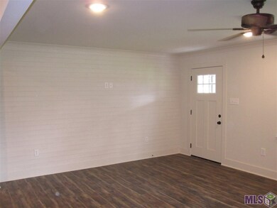 LIVING ROOM WITH ACCENT SHIP LAP WALL