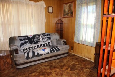 The paneled Living Room is a nice size and has lot