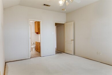 Primary bedroom with ensuite bathroom and lofted c