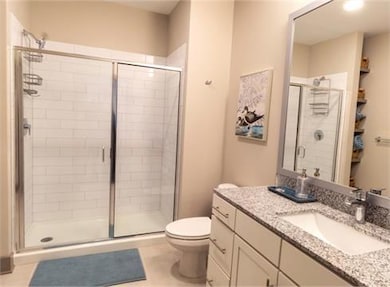Bathroom with a shower with shower door, oversized