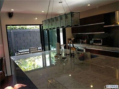 Kitchen with view out to the patio.