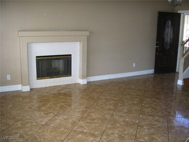 Entrance foyer featuring baseboards and a tile fir