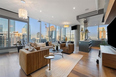 Living area with floor to ceiling windows, a nota