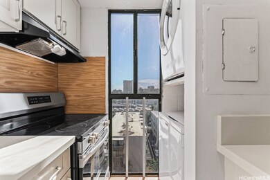 The galley-style kitchen offers efficient storage,