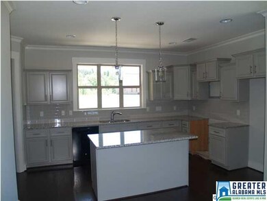 THREE WINDOWS OVER THESINK FLOOD THE KITCHEN WITH 