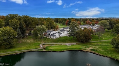 Aerial view of a local golf course and a nearby body of water
