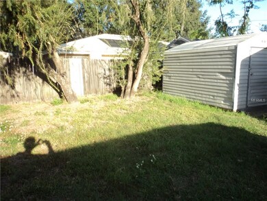 Right portion of the backyard with two (2) storage