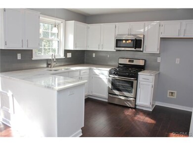 Refinished cabinets, marble counter tops with stai