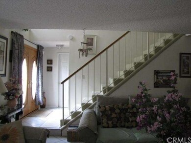 STAIRCASE TO THE SIDE OF DOUBLE DOORS.