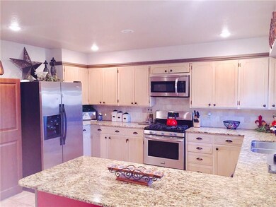 New granite and tumbled back splash.