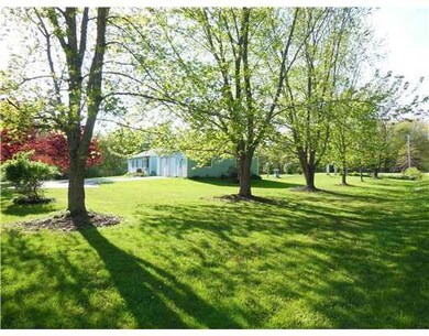 Exterior Front. Large open yard...