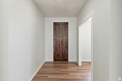 Corridor with wood finished floors