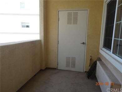 Balcony overlooking the view of the pool.  Storage