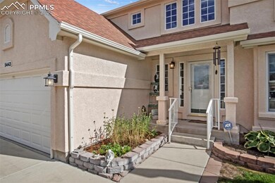 View of exterior entry featuring a garage