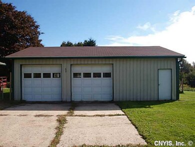 Garage. Two car garage has another bay for worksho